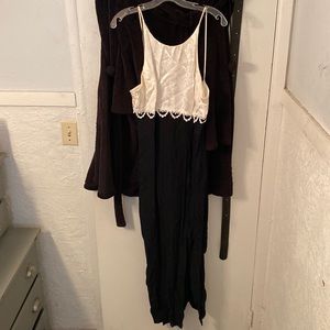 Long formal dress white on top and black bottom has slit on side